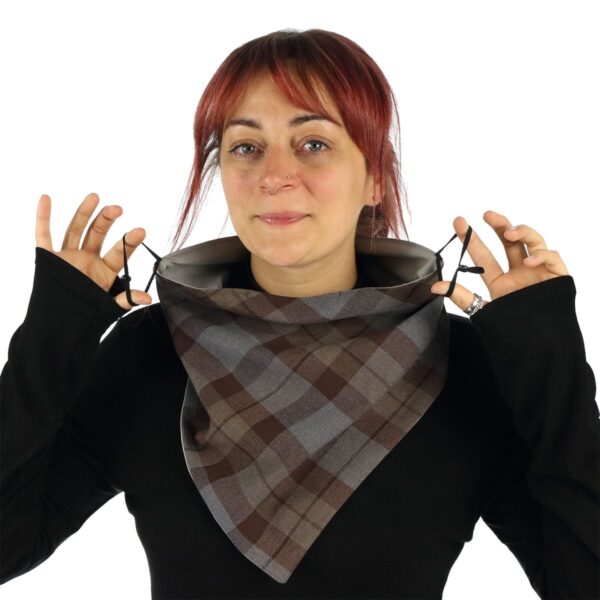 A woman wearing Tartan Bandana Masks - Wool Free made of poly/viscose tartan fabric.