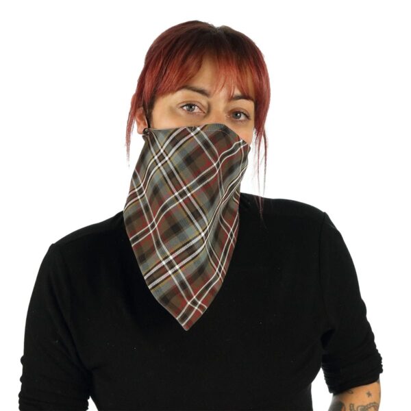 A woman wearing a Tartan Bandana Masks - Wool Free tartan bandana.