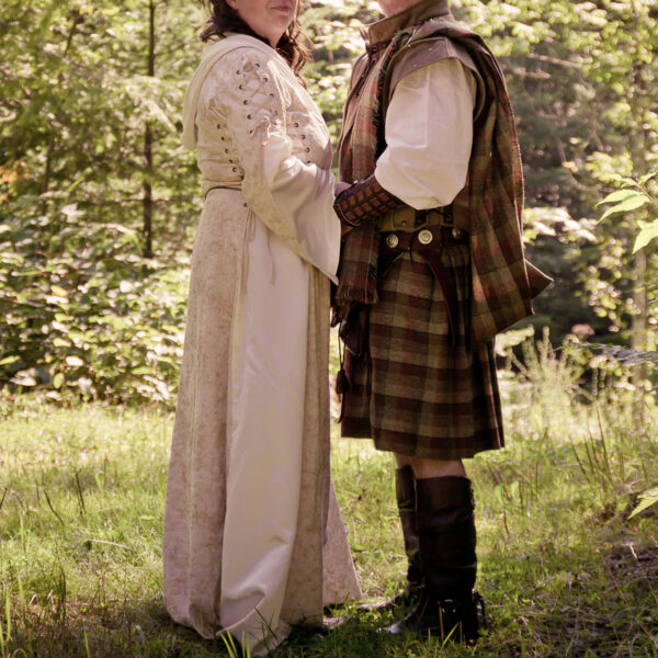 A man and woman dressed in the Heavy Weight 16oz Premium Wool Ancient Kilts.