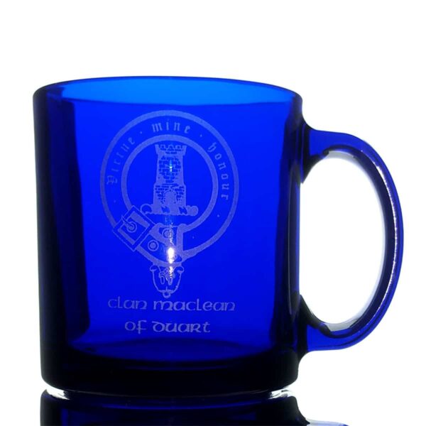 A Clan Crest Coffee Mug - Engraved Blue Glass with a clan crest on it.