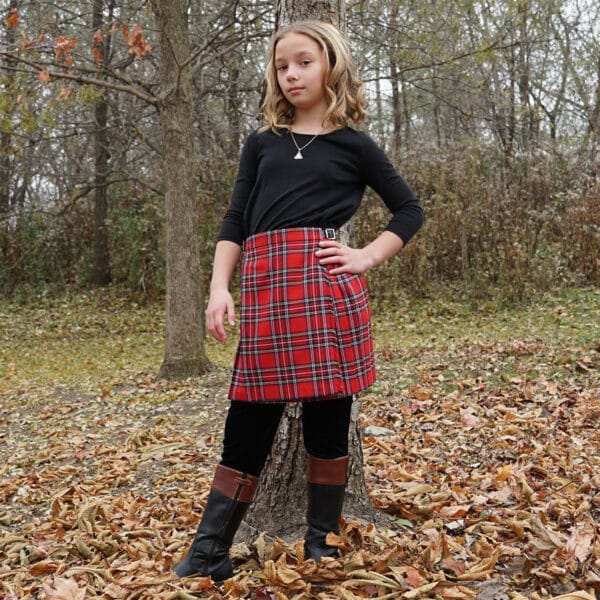 A young girl wearing a Premium Wool-Free Kid Kilt.