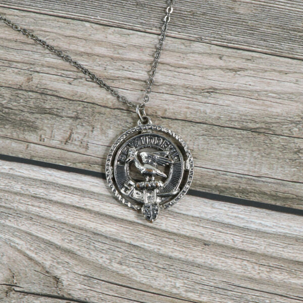 A silver Clan Crest Necklace.