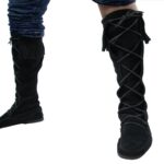 A person wearing a pair of Mens Suede Knee High Boots with laces.