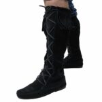 A man wearing a pair of Mens Suede Knee High Boots with tassels.