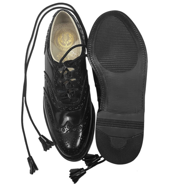 A pair of black shoes with tassels and laces.
