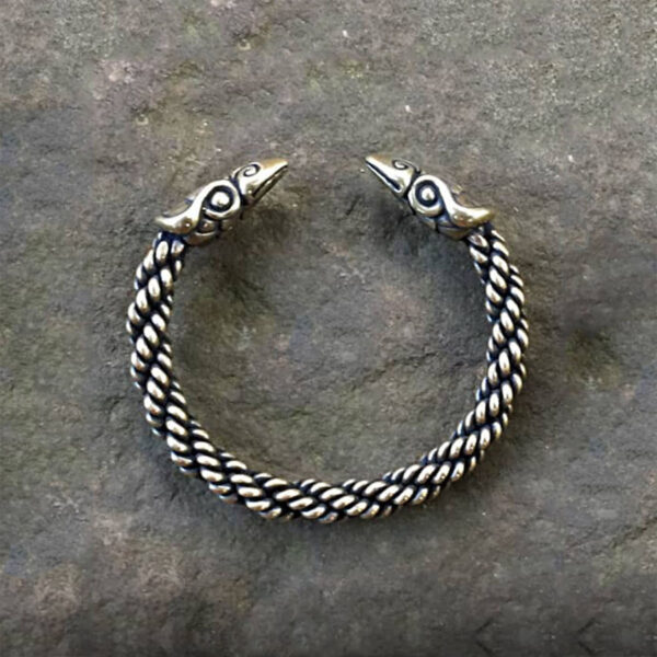 A Celtic Raven Torc Bracelet with a braided pattern.