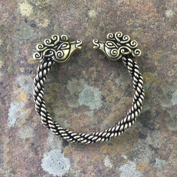 A Celtic Stag Torc Bracelet with two stag horns accentuating its design.