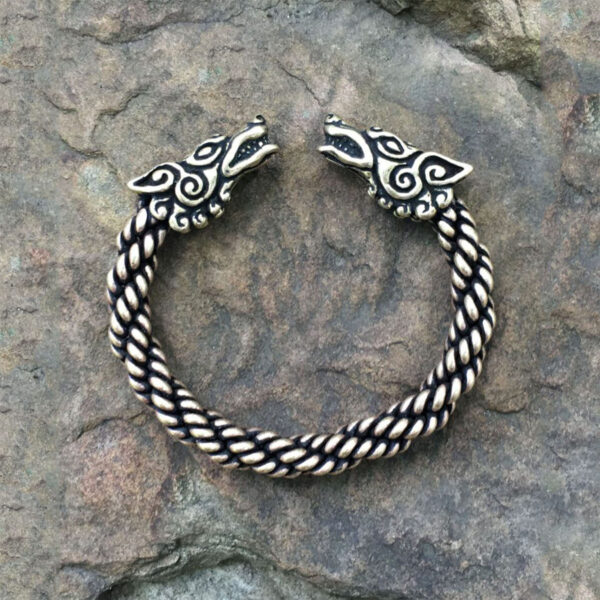 A Celtic Wolf Torc Bracelet featuring two viking heads.
