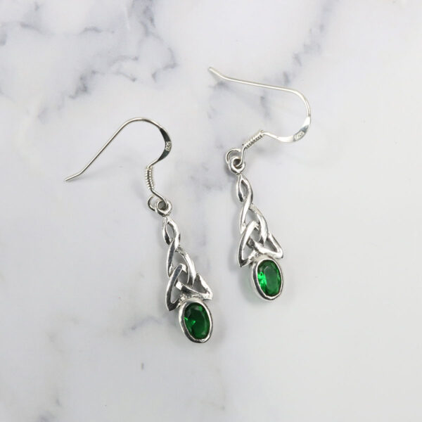 Triquetra sterling silver earrings with emerald stones. -> [Product Name]: Triquetra Sterling Silver Earrings with Emerald Stones.