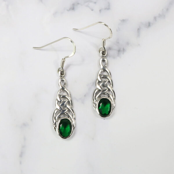 Triquetra Sterling Silver Earrings, adorned with emerald stones.