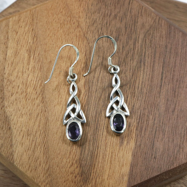 Triquetra Sterling Silver Earrings featuring amethyst stones.