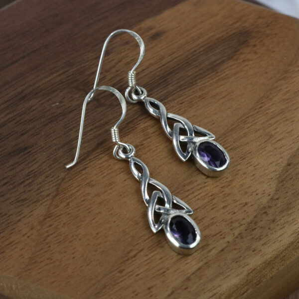 A pair of sterling silver Amethyst Triquetra earrings.