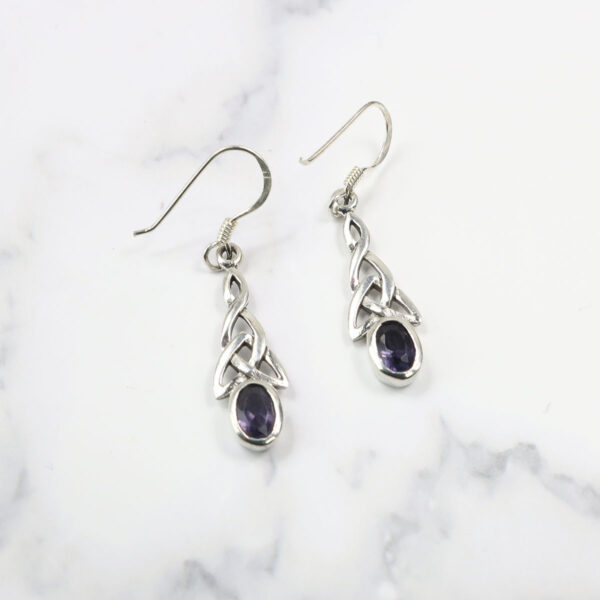 Triquetra Sterling Silver Earrings adorned with amethyst stones.