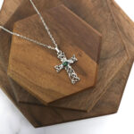 Amethyst Celtic Knot Necklace with emerald stone and amethyst accent.