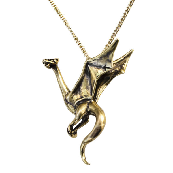 A Perched Wyvern Dragon Pendant on a gold chain.