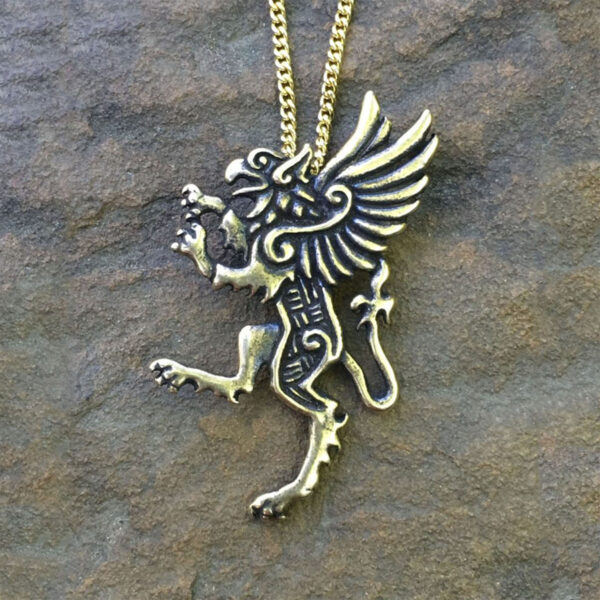 A Celtic Griffin Pendant on a stone.