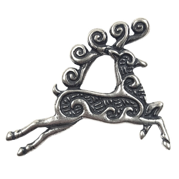A silver reindeer brooch with swirls on it, also known as a Celtic Stag Pendant.