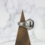 Dragon's Eye Ring: A mesmerizing silver ring featuring a captivating black stone on top, resembling the majestic gaze of a dragon.