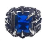 A Dragon Claw Stainless Steel Ring with spikes and a blue stone.