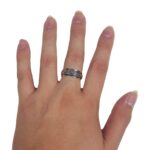 A woman's hand with a Large Celtic Knot Spinner Ring on it.