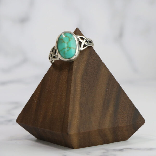 A Turquoise Triquetra Ring.