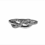 An Infinity Knot Ring with diamonds on a white background.