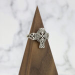 Sterling silver Celtic cross ring with a Two Tone Eternity Knot Band.