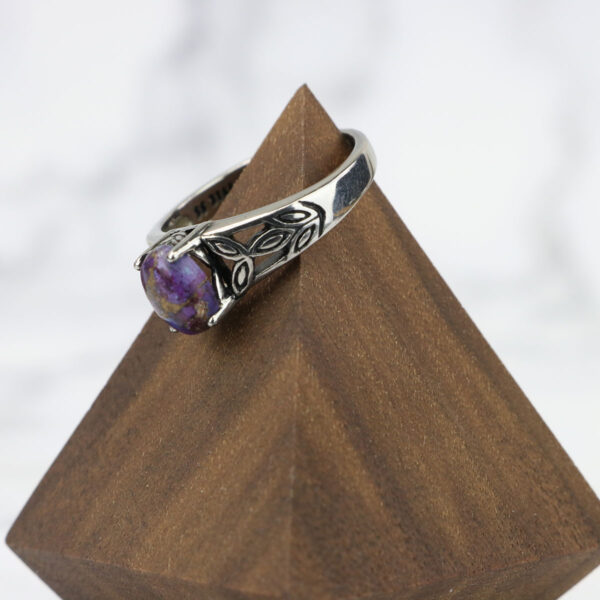A Purple Mohave Turquoise Triquetra Ring.