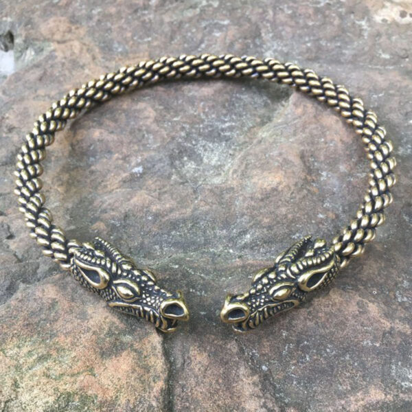 A Celtic Dragon Neck Torc featuring two intricately designed dragon heads.