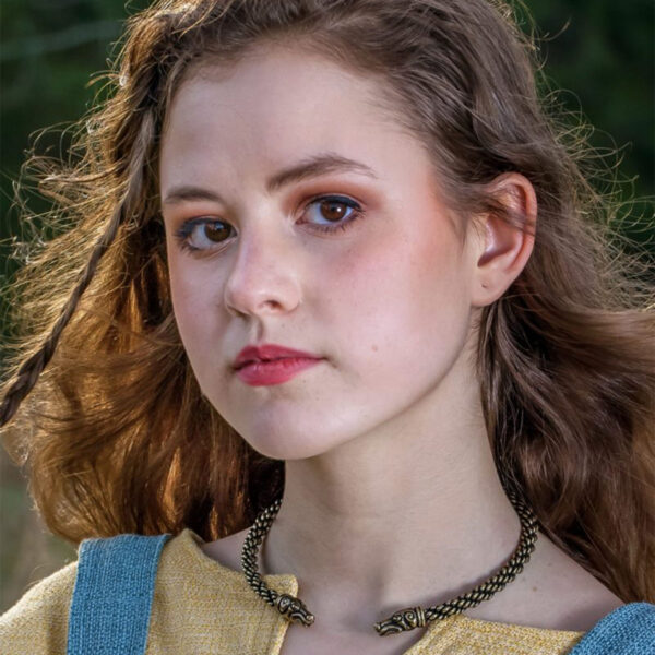 A young girl with long hair and a necklace wearing a Celtic Greyhound Torc - Medium Braid.