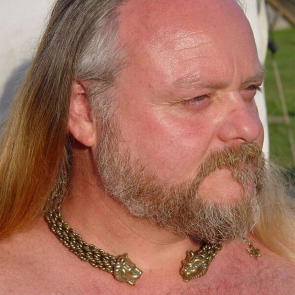 A lion-man with long hair, wearing a Celtic Lion Torc - Extra Heavy Braid around his neck.