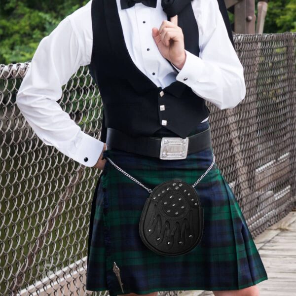 A man in a Black Watch Kilt and Sporran Rental Package poses for a picture.