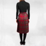 A woman wearing an Old & Rare Tartans Standard Ladies' Kilted Skirt.