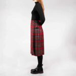 A woman wearing an Old & Rare Tartans Standard Ladies' Kilted Skirt.
