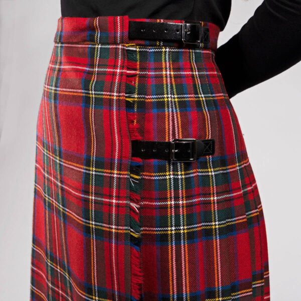 A woman wearing an Old & Rare Tartans Standard Ladies' Kilted Skirt.