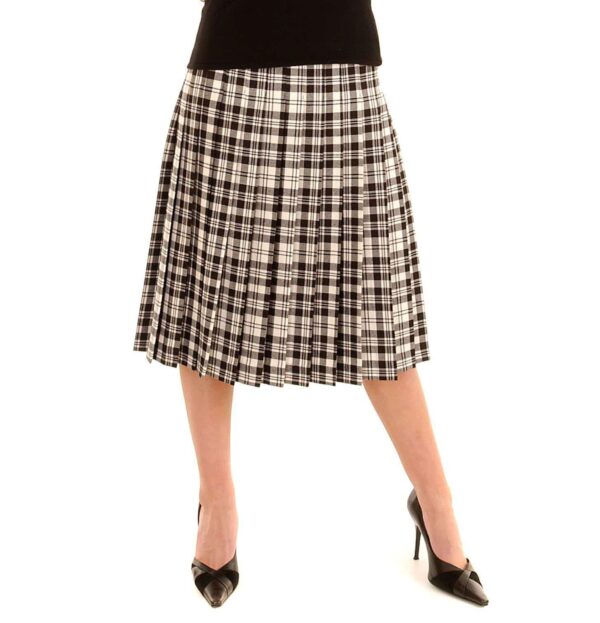 Fiona, wearing a stylish black and white plaid Fiona Skirt Light Weight 11oz Premium Wool made of light weight 11oz premium wool.