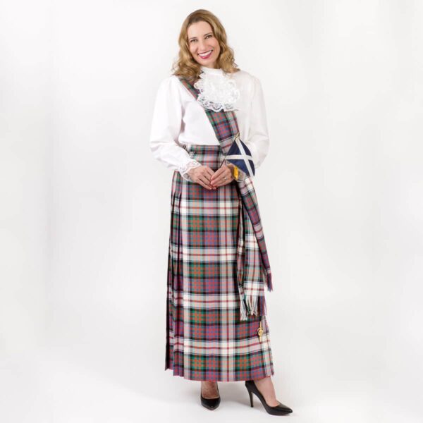 A woman in a tartan kilt posing for a photo in her Medium Weight Premium Wool Hostess Kilted Skirt.