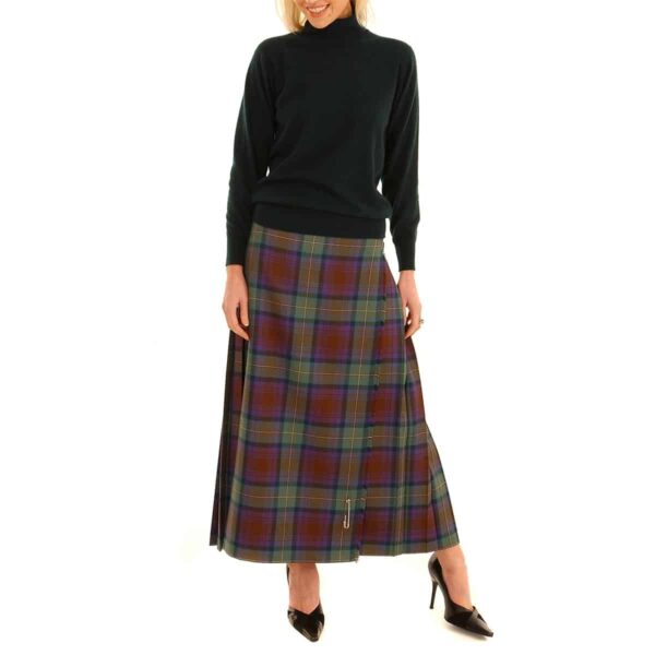 A woman is posing in a Medium Weight Premium Wool Hostess Kilted Skirt made of premium wool.