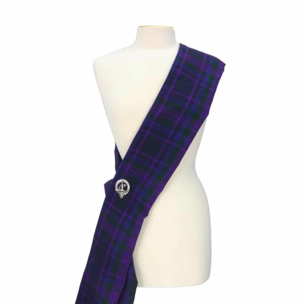 A purple and purple tartan sash on a mannequin.