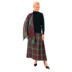 A woman wearing a Spring Weight Tartan Shawl.