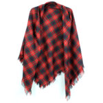 A red and black Spring Weight Tartan Shawl hanging on a hanger.