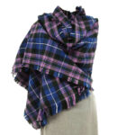 A STARFLEET Tartan Stole with fringes on a mannequin dummy.