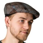 A man wearing an OUTLANDER Golf Cap Authentic Premium Wool Tartan.