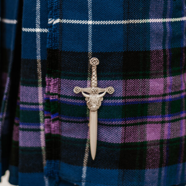 A Quality Wool Blend Kilt with Matching Tartan Flashes and FREE Kilt Hanger on a blue plaid jacket.