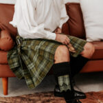 A man sporting a Quality Wool Blend Kilt with Matching Tartan Flashes and FREE Kilt Hanger.