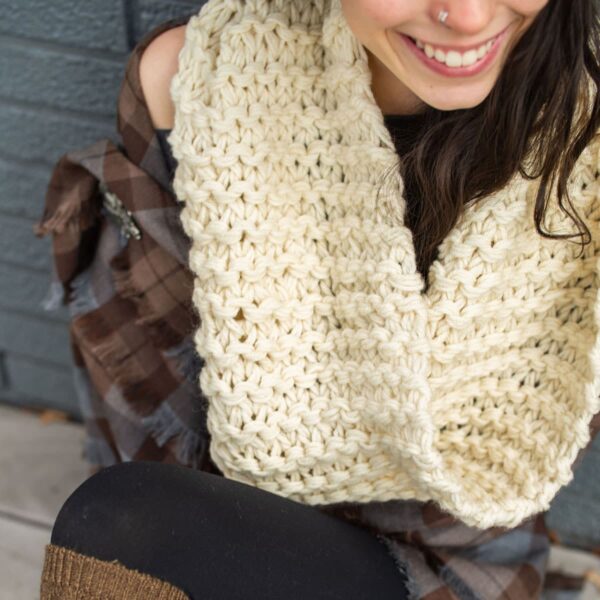 A woman wearing a crocheted OUTLANDER Inspired Custom-Made Hand-Knit Cowl-inspired infinity scarf.