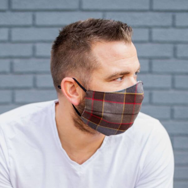 A man wearing a plaid face mask.