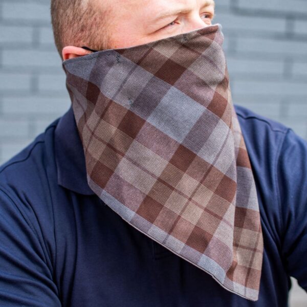 A man wearing a plaid bandana.