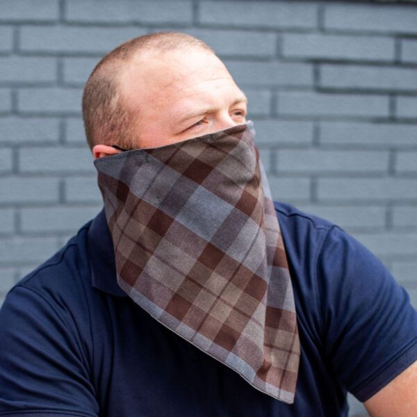 A man wearing a plaid bandana.