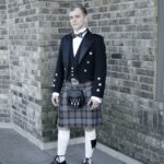 A man in an OUTLANDER 5 Yard Poly/Viscose Tartan Kilt.